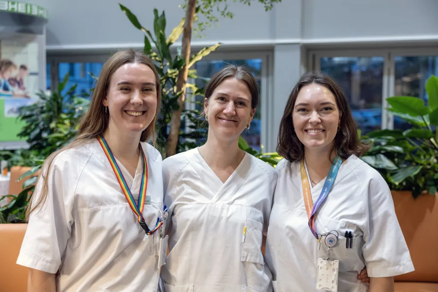 A group of women wearing white shirts and badges
