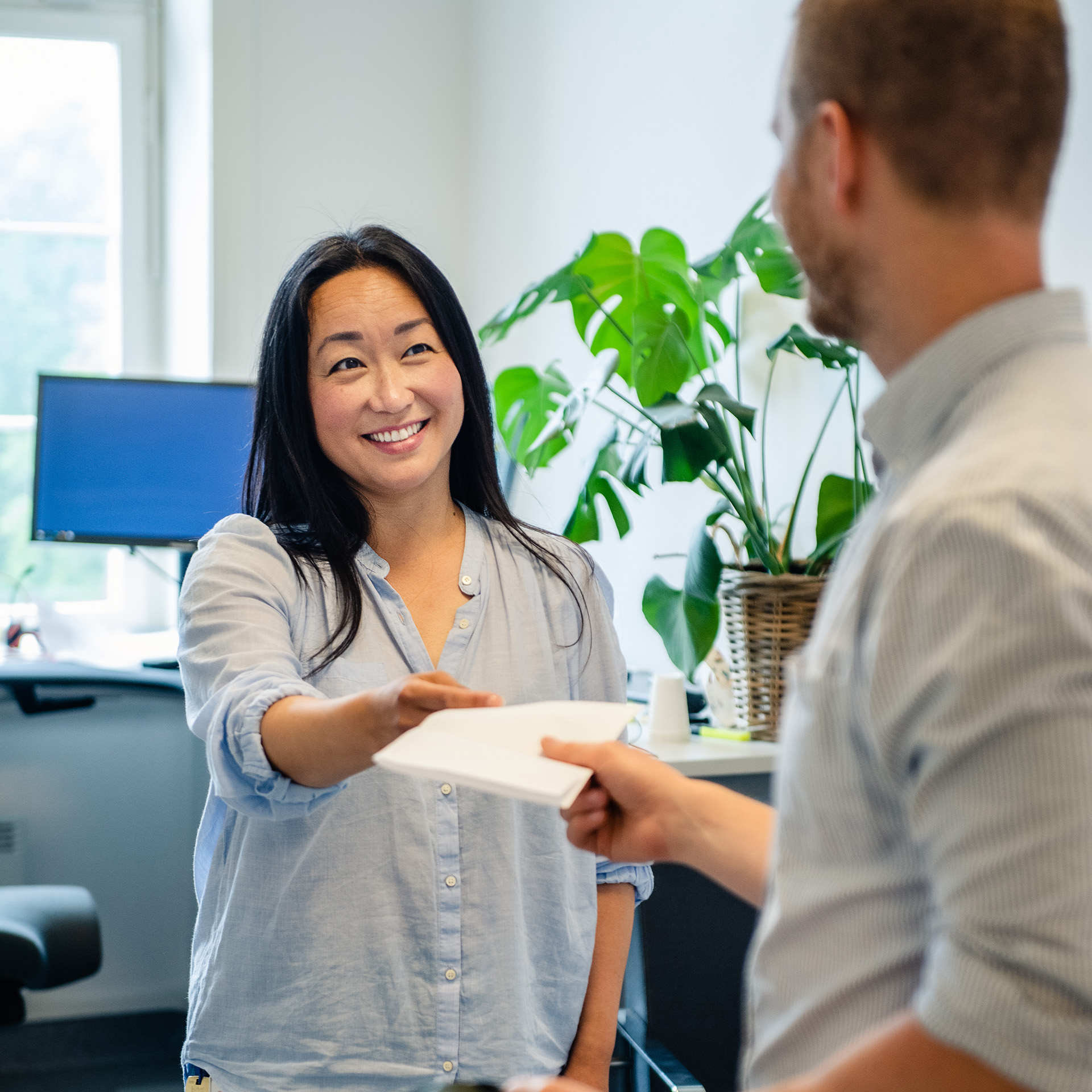 A person holding a piece of paper