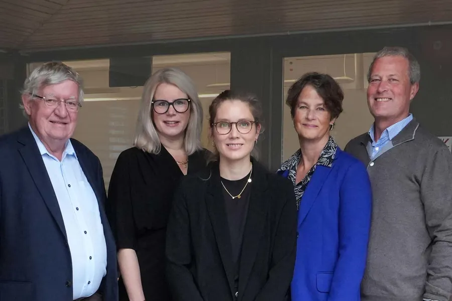 A group of people posing for a photo