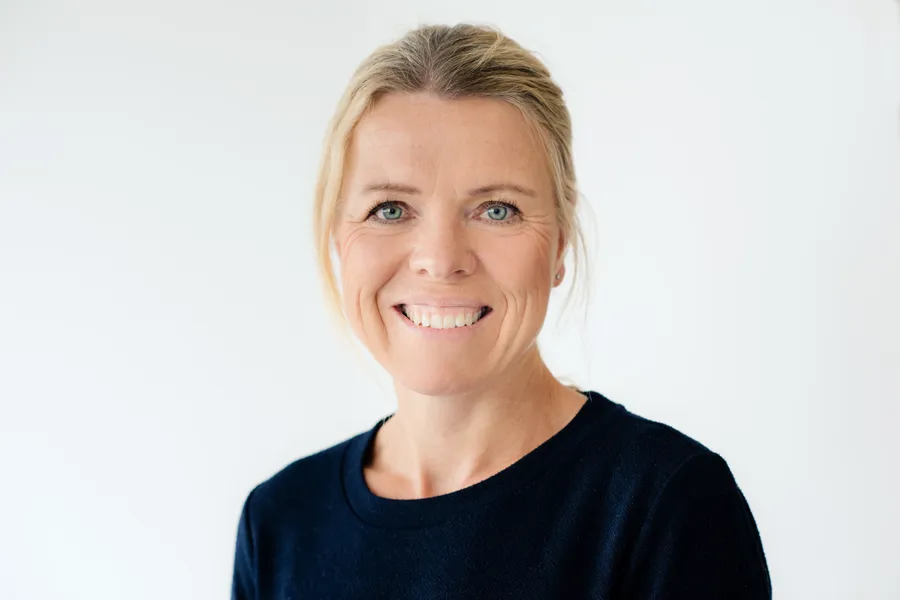 En person som smiler for kameraet