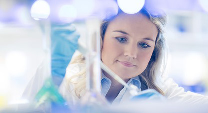 A woman in a white coat