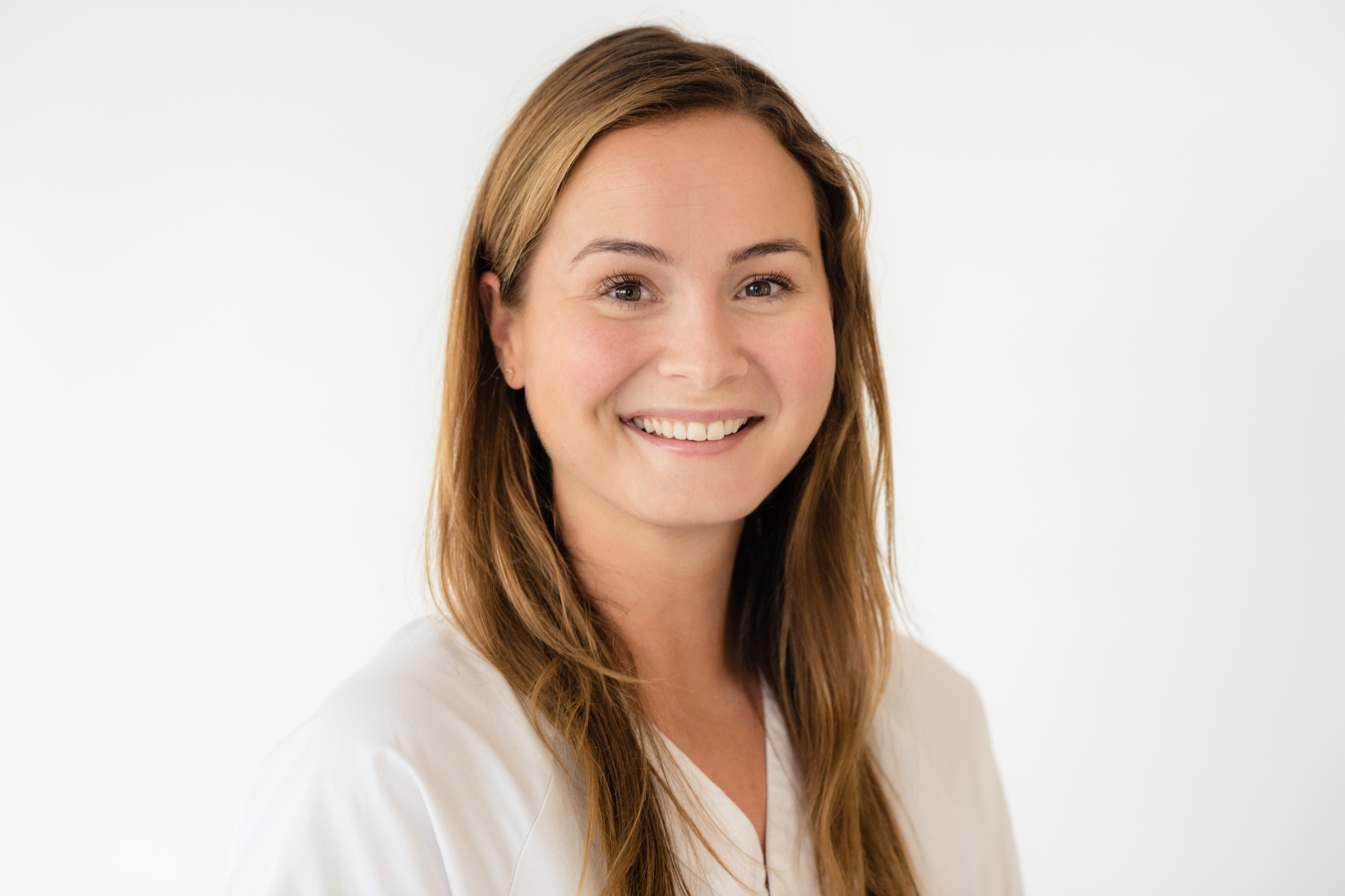 En person som smiler for kameraet