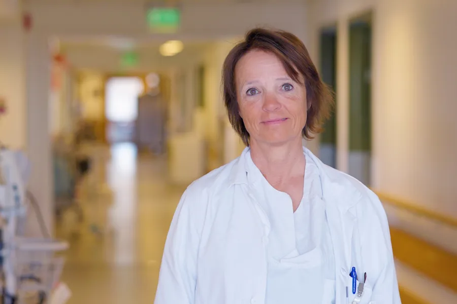 A man in a white coat