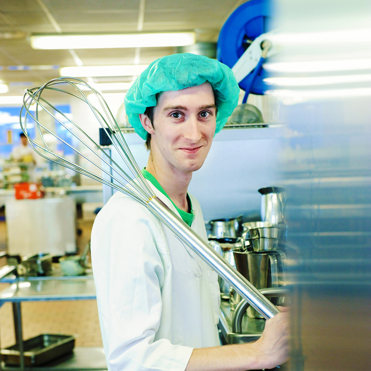 En person i grønn hatt